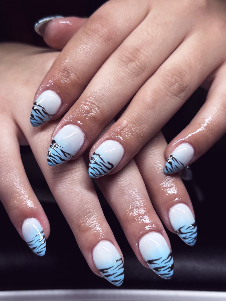 Milky blue almond Gel X set with navy tiger stripes